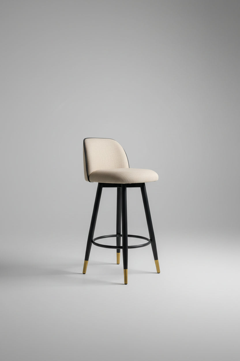 Bar stool with beige seat and black frame on a light gray background