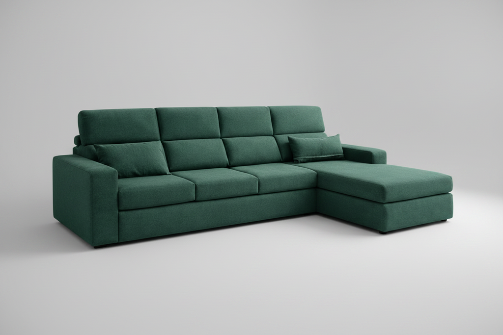 Green sectional sofa in a living room with a coffee table and decor items.