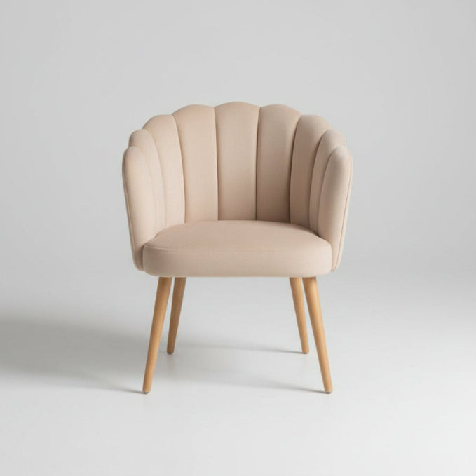 Beige armchair with wooden legs on a light gray background